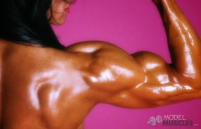 Marina Lopez oiled up posing her biceps