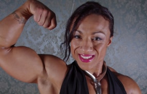 Karen Garrett in black dress posing 